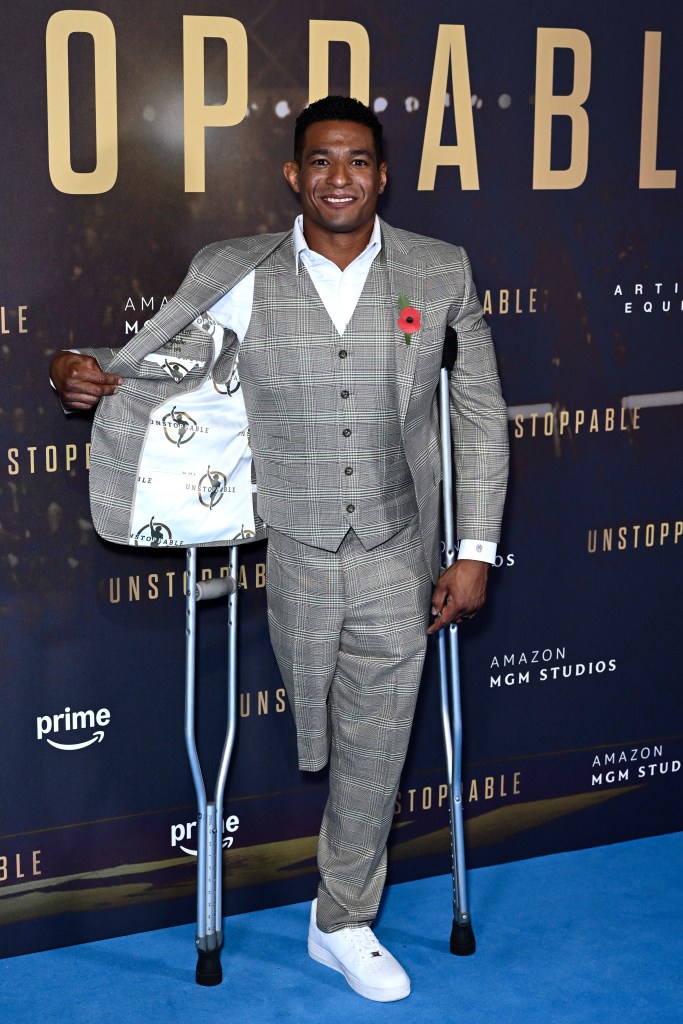 Anthony Robles in a suit with crutches at the Unstoppable UK Special Screening, Cineworld Leicester Square, London, November 05, 2024