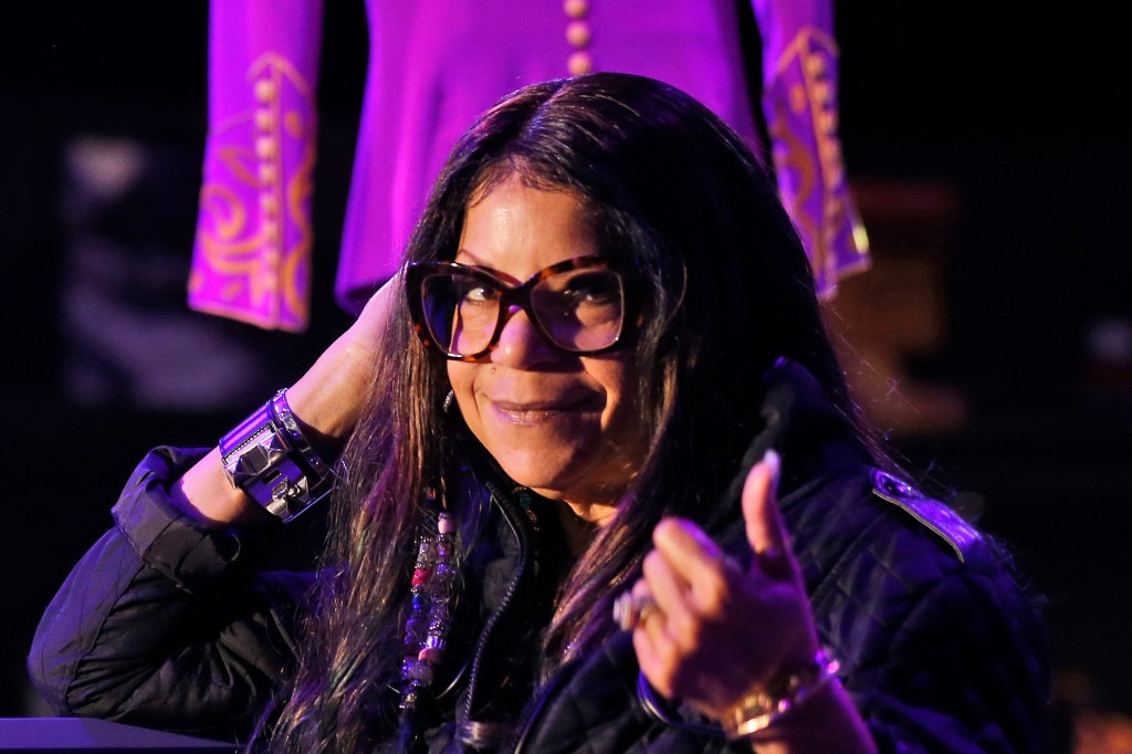 Tyka Nelson, sister of the late musician Prince, appears in front of his costumes at the "My Name is Prince" exhibition at the O2 Arena in London, on Oct. 26, 2017.